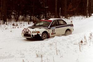 The Chris Gilligan / Joe Petersen Mitsubishi Evo IV sets up for a hard-right near the end of day two of the rally.