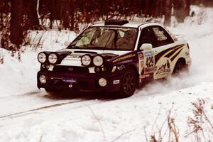 The Tanner Foust / Scott Crouch Subaru WRX sets up for a hard-right near the end of day two of the rally.