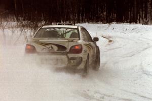 The Tanner Foust / Scott Crouch Subaru WRX drifts through a hard-right near the end of day two of the rally.