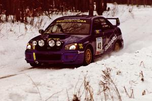 The Ken Block / Christian Edstrom Subaru WRX STi sets up at a hard-right near the end of day two of the rally.