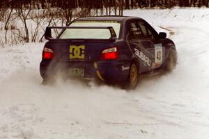 The Ken Block / Christian Edstrom Subaru WRX STi powers out a hard-right near the end of day two of the rally.