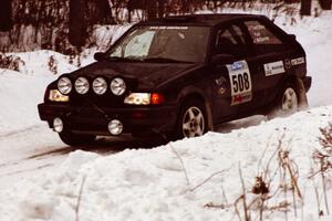 The Tom Ottey / Pam McGarvey Mazda 323GTX at a hard-right near the end of day two of the rally.