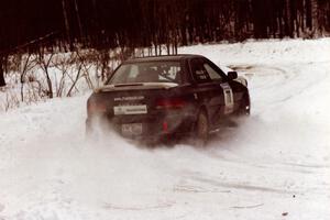 The Mark Podoluch / Kazimierz Pudelek Subaru Impreza exits a hard-right near the end of day two of the rally.