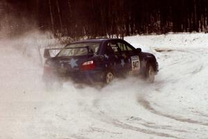 The William Bacon / Peter Watt Subaru WRX STi hits the power at a hard-right near the end of day two of the rally.