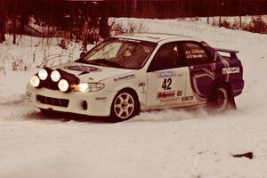 The Eric Burmeister / Dave Shindle Mazda Protege MP3 exits a hard-right near the end of day two of the rally.