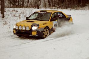 The Wojtek Okula / Adam Pelc Subaru WRX exits a hard-right near the end of day two of the rally.