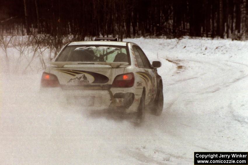 The Tanner Foust / Scott Crouch Subaru WRX drifts through a hard-right near the end of day two of the rally.