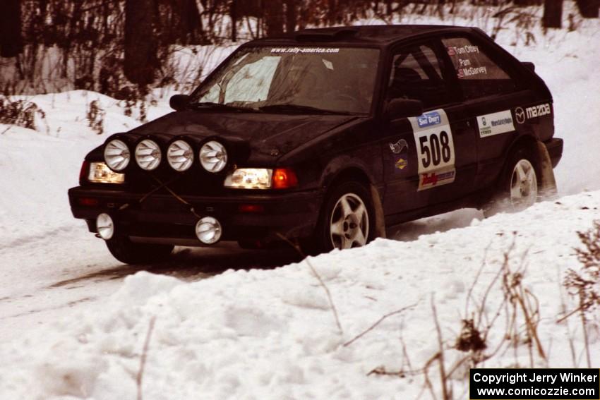 The Tom Ottey / Pam McGarvey Mazda 323GTX at a hard-right near the end of day two of the rally.