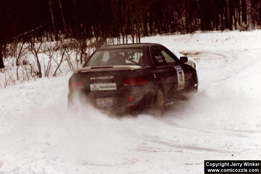 The Mark Podoluch / Kazimierz Pudelek Subaru Impreza exits a hard-right near the end of day two of the rally.