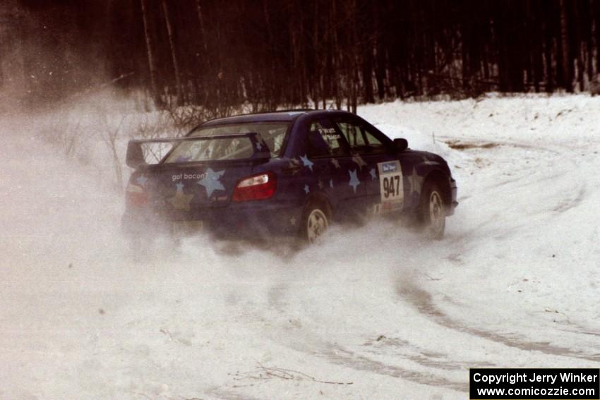 The William Bacon / Peter Watt Subaru WRX STi hits the power at a hard-right near the end of day two of the rally.