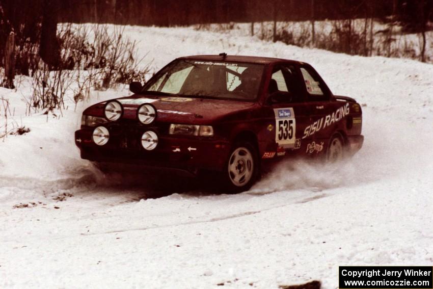 The Jake Himes / Matt Himes Nissan Sentra SE-R exits a hard-right near the end of day two of the rally.