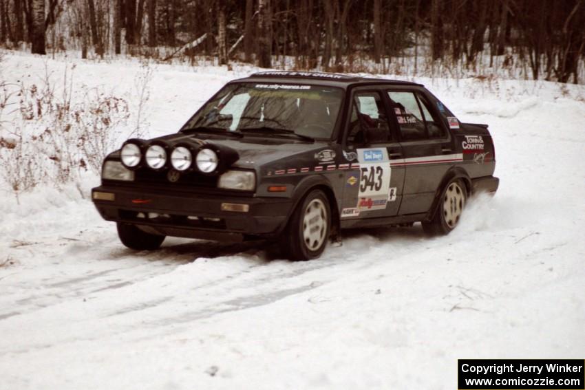 The Mike Merbach / Jeff Feldt VW Jetta exits a hard-right near the end of day two of the rally.