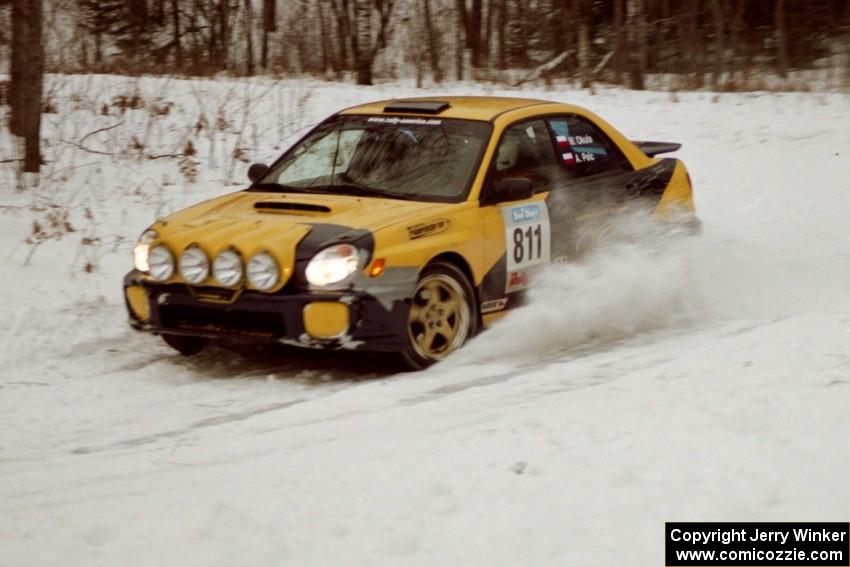 The Wojtek Okula / Adam Pelc Subaru WRX exits a hard-right near the end of day two of the rally.