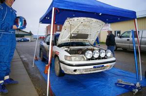 Mike Wray / John Nordlie Subaru Legacy Sport keeps out of the rain at Akeley service (2).