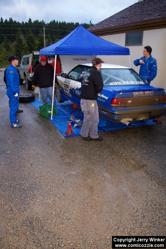 Mike Wray / John Nordlie Subaru Legacy Sport keeps out of the rain at Akeley service (3).