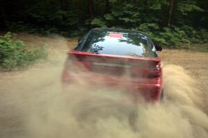 Micah Wiitala / Jason Takkunen Mitsubishi Eclipse at speed through a left-hander on SS1.