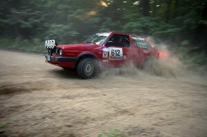 Karl Biewald / Ted Weidman VW GTI at a hairpin on SS1.