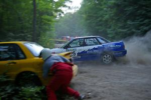 Mike Wray / John Nordlie Subaru Legacy Sport blasts past the stuck Mitsubishi Galant of Erik Payeur / Adam Payeur on SS1.