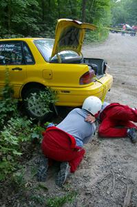 Erik Payeur / Adam Payeur Mitsubishi Galant got stuck atop a boulder at the apex of a corner on SS1 (3).