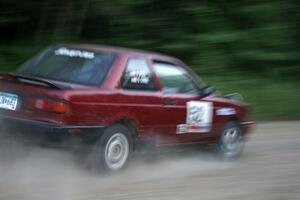 Rob Stroik / Ross Wegge Nissan Sentra SE-R at speed on a straight on SS2.