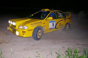 Lauchlin O'Sullivan / Scott Putnam Subaru Impreza on a 90-left on SS6 at 1AM.