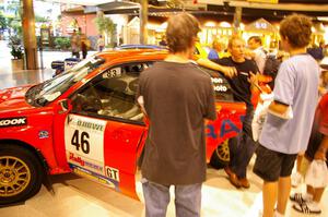 Rally fans check the inside of the Matthew Johnson / Wendy Nakamoto Subaru WRX at Rallyfest at the Mall of America.