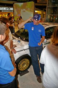 Travis Pastrana talks fans about rallying in front of the Ken Block / Alex Gelsomino Subaru WRX STi.