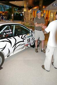 Matt Iorio discusses his Subaru Impreza to new rally fans at the Mall of America.