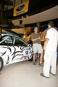 Matt Iorio discusses his Subaru Impreza to new rally fans at the Mall of America. Ole Holter was his navigator for the weekend.