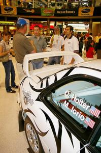 Matt Iorio discusses his Subaru Impreza to new rally fans at the Mall of America. Ole Holter was his navigator for the weekend.