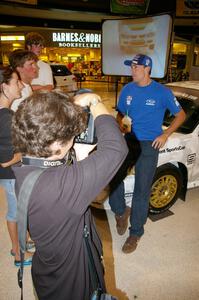 Travis Pastrana poses for the press in front of the Ken Block / Alex Gelsomino Subaru WRX STi.