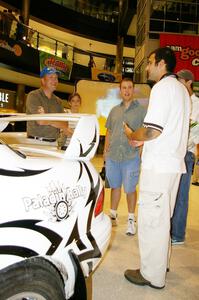 Matt Iorio discusses his Subaru Impreza to new rally fans at the Mall of America. Ole Holter was his navigator for the weekend.