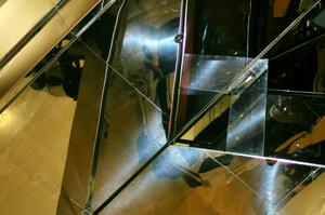 Rally cars are mirrored above the escalators at the Mall of America.