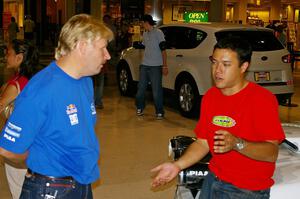 Lance Smith and Pat Richard converse at the Mall of America rally display.
