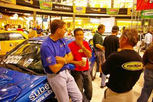Scott Putnam, Pat Richard, and Pat's father converse over coffee at the Mall of America.