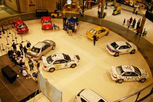 A view from the upper floor of the Mall of America of rally cars on display (2).