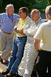 Stig Blomqvist and crew relax before the start of the rally on day one.