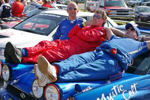 Mark McElduff and Damien Irwin relax on the hood of their Subaru WRX STi at parc expose on day one.