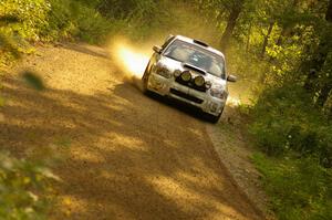 Ken Block / Alex Gelsomino Subaru WRX STi at speed through a fast left-hand sweeper on SS1, Halverson Lake.