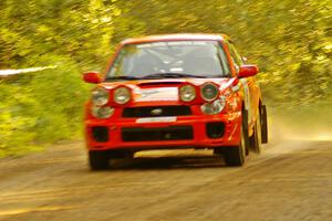 Matthew Johnson / Wendy Nakamoto Subaru WRX comes out of a fast left-hander on Halverson Lake, SS1.