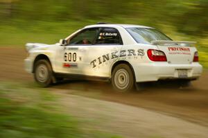 Fintan McCarthy / Noel Gallagher Subaru WRX STi at speed down a straight on Halverson Lake, SS1.