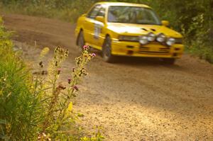 Erik Payeur / Adam Payeur Mitsubishi Galant blasts past a cluster of thistles through the final corner of Halverson Lake, SS1.