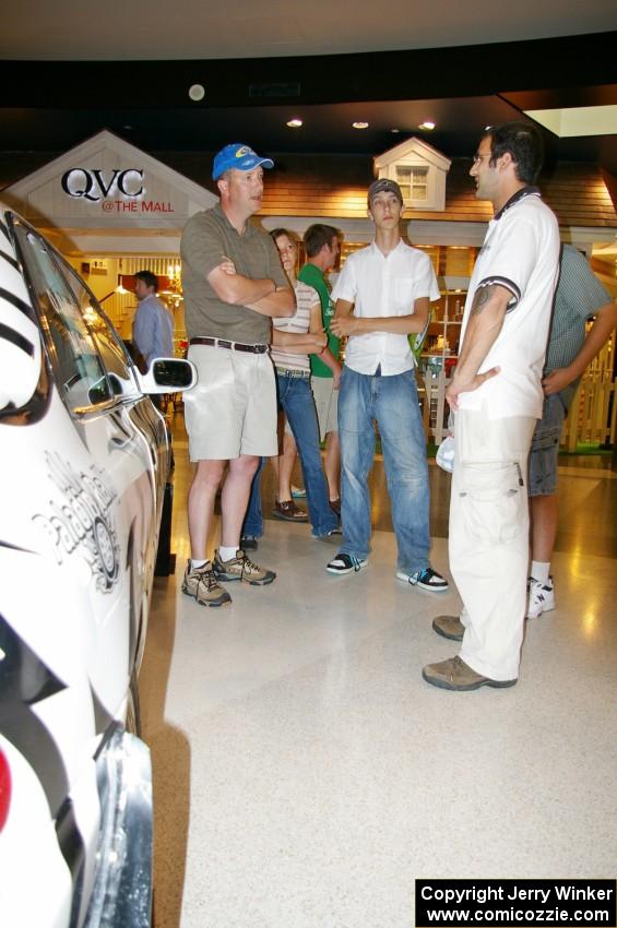 Matt Iorio discusses his Subaru Impreza to new rally fans at the Mall of America.