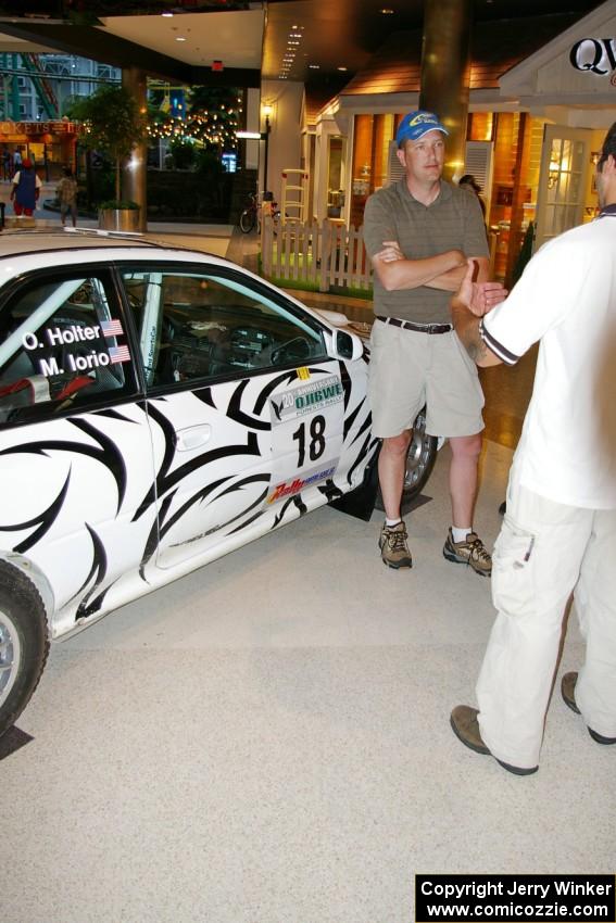 Matt Iorio discusses his Subaru Impreza to new rally fans at the Mall of America.