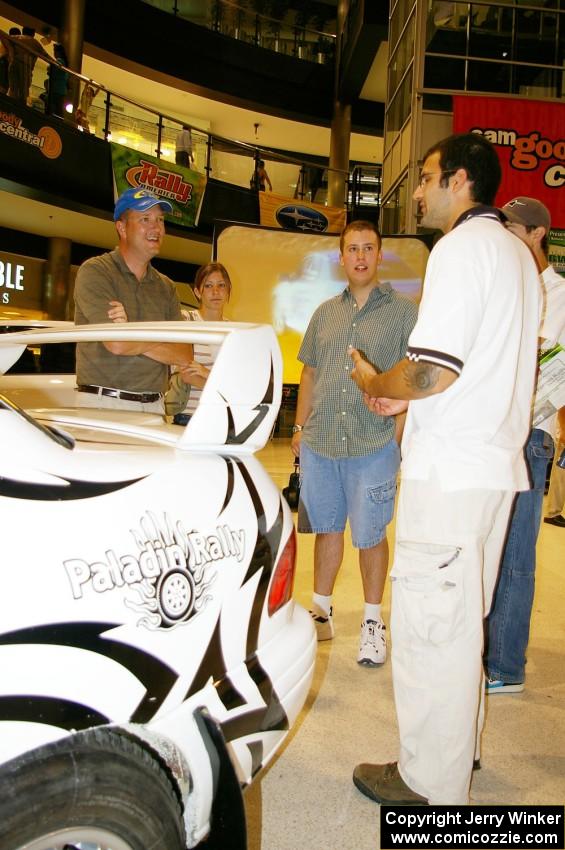 Matt Iorio discusses his Subaru Impreza to new rally fans at the Mall of America. Ole Holter was his navigator for the weekend.