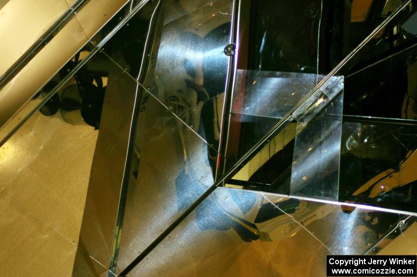 Rally cars are mirrored above the escalators at the Mall of America.