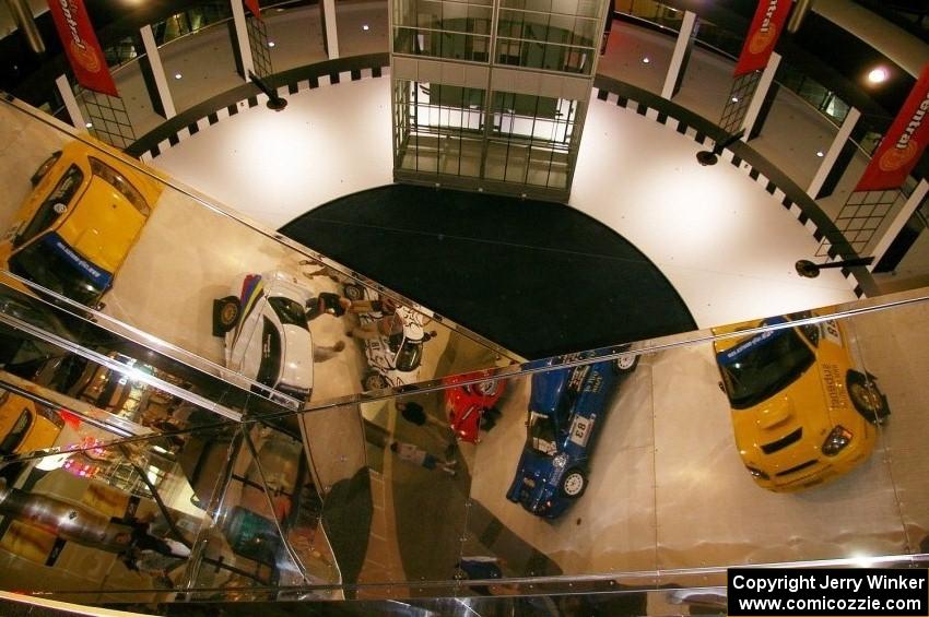 Rally cars are mirrored above the escalators at the Mall of America.