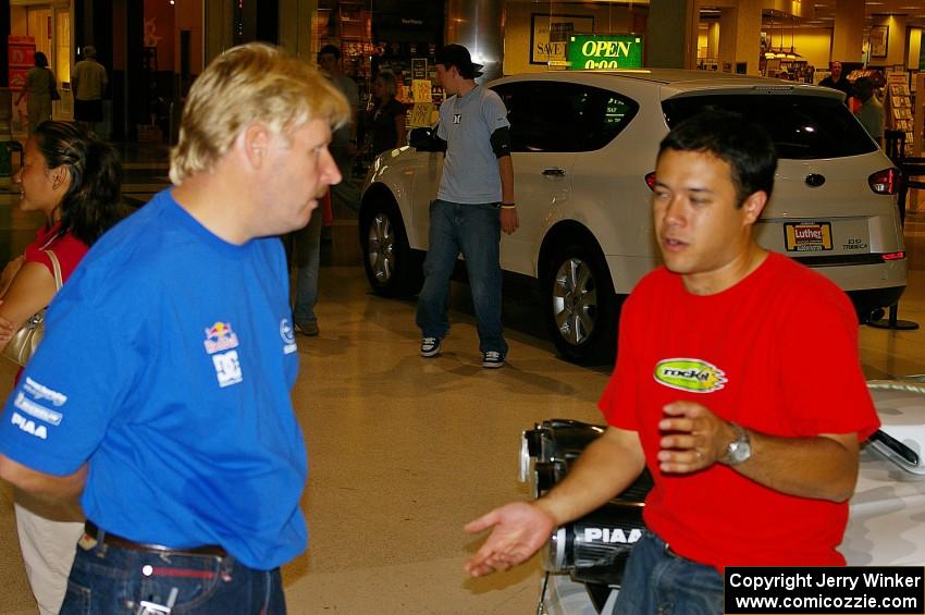 Lance Smith and Pat Richard converse at the Mall of America rally display.