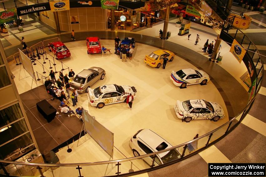 A view from the upper floor of the Mall of America of rally cars on display (1).