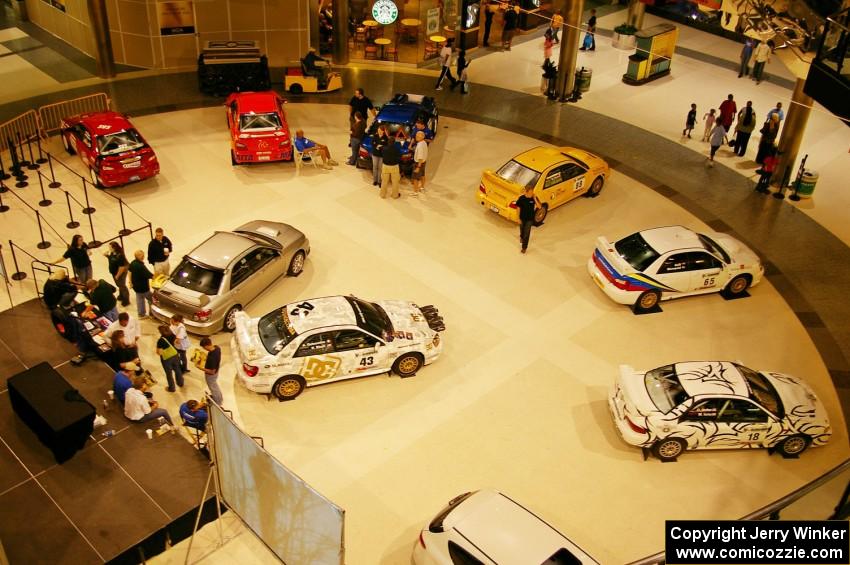 A view from the upper floor of the Mall of America of rally cars on display (2).